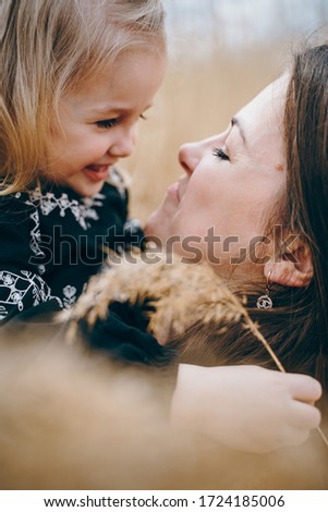 Young mother hugs her daughter. Mother's Day