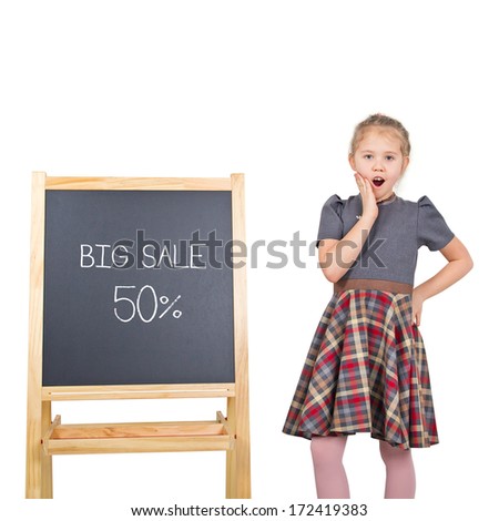 Marketing sale concept. Colorful studio portrait of beauty little girl with chalkboard isolated on white background. Chalkboard with sale text. (isolated with clipping path)