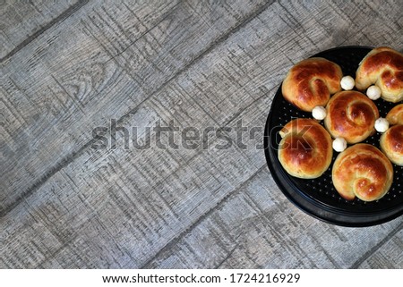 Homemade hot pastries on a light wooden background