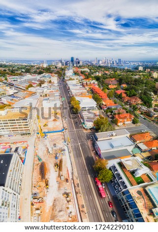 New Sydney Metro train station in Crows Nest suburb of Lower North shore - aerial vertical panorama towards city CBD and Harbour. Royalty-Free Stock Photo #1724229010