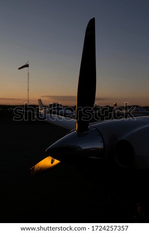 airplane at sunset in the hangar