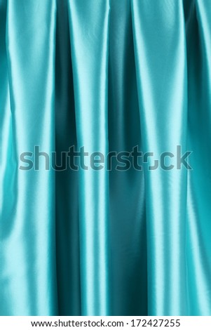 Blue silk. Whole background. Close up. Texture.