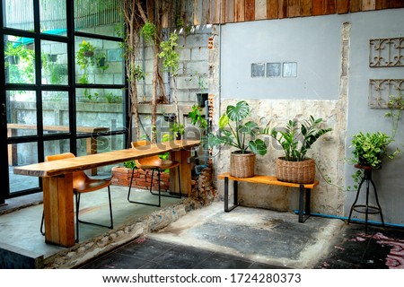 coffee shop indoor with wood bar and plant  Royalty-Free Stock Photo #1724280373