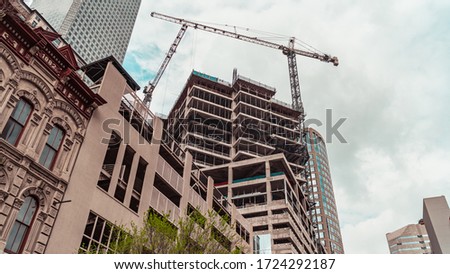 Construction and cranes on buildings in downtown Houston, TX 