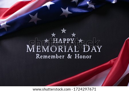 Happy Memorial Day.  American flags against a black paper background with text Happy Memorial Day.