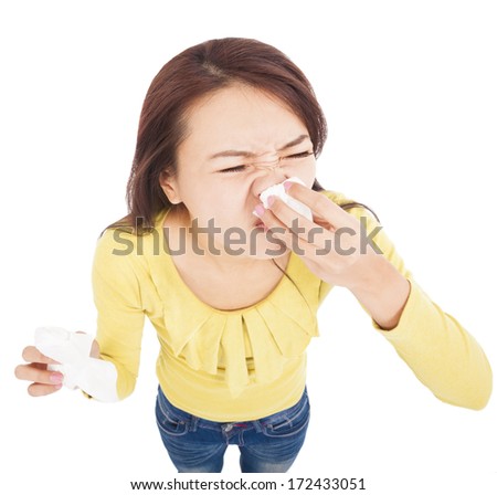 young woman is sneezing with painful face  