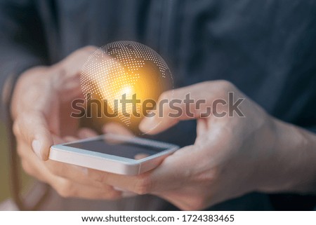 Business man holding global network international business network internet technology over on smartphone concept.