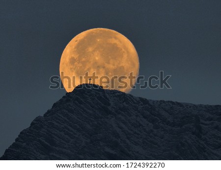 Full moon with mountain peak