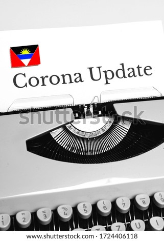 A Typewriter Typing the NEWS of COVID-19 with the Flag of Antigua & Barbuda.