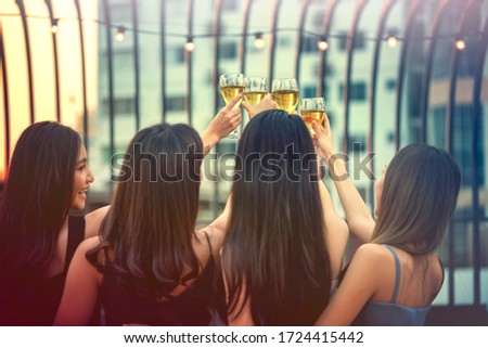 Party time start. Happy people toasting with champagne flutes. Multiethnic friends congratulating each other with new year. Celebration holiday concept, holiday background. selective focus.