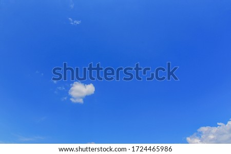 Beautiful minimal single nature white cloud on clear blue sky background. with copy space. Royalty-Free Stock Photo #1724465986