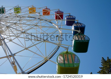 Under view of Colorful Ferris wheel on blue sky background, In an amusement park,Aichi Japan 