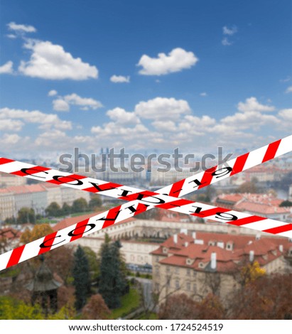 Coronavirus in Prague, Czech Republic. Cityscape of Prague from above. Covid-19 sign on a blurred background. Concept of COVID pandemic and travel in Europe.
