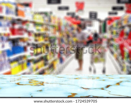 Marble top table on blur supermarket background
