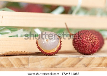 Fresh organic lychee fruit on the basket.
