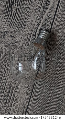 lught bulb on wooden background stick photo