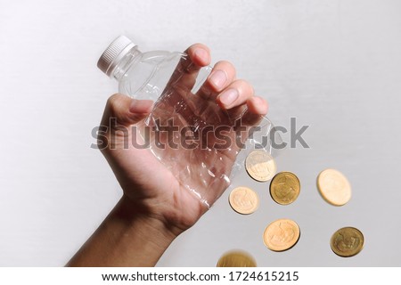 Plastic Bottle transfer to Money. Recycle plastic bottle to money. Concept for recycle and make money with plastic bottle. Making fortune by selling plastic bottle Royalty-Free Stock Photo #1724615215