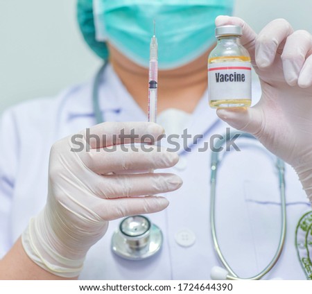Doctor holding syringe vaccine vial-Medicine, pharmaceutical research and health care concept.copy spac
