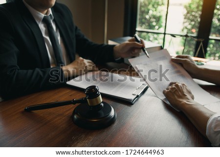 Man judge is currently advising clients on their requests for legal proceedings and legal advice. Royalty-Free Stock Photo #1724644963