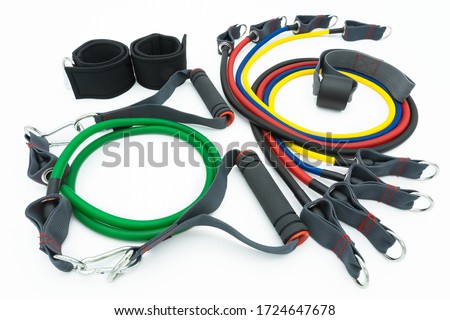 A set of colorful resistance bands,door anchor and foot ring isolated on the white background.