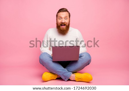 Full body photo astonished guy freelancer entrepreneur work laptop search social media discounts impressed scream wow omg wear good look sweater jeans isolated pastel color background