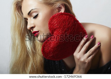 Lovely Beautiful Blond Woman with Red Heart. Beauty Girl. Show Love Symbol. Valentine's Day