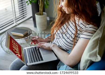 High angle view of woman doing online shopping