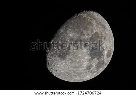 A mesmerizing closeup shot of The Waxing Gibbous Moon with visible craters and the Sea of Tranquility