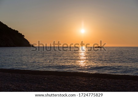sunset at Myrtos beach, kefalonia island in Greece
