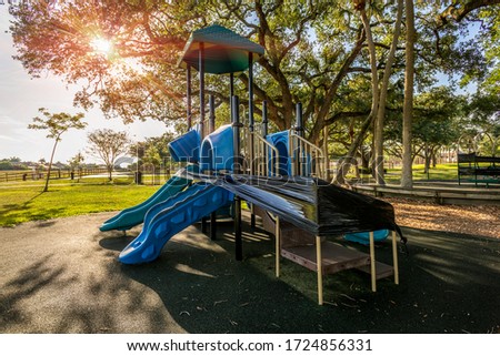 Due to the coronavirus COVID-19 parks in Deerfield Beach, Broward County, Florida have taped off all the play gyms and benches to keep away large crowds of children and adults.