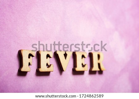 Fever text on a colored paper.