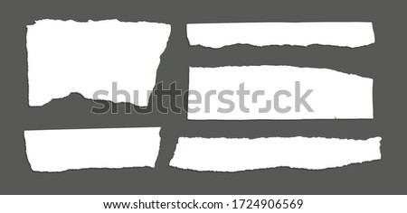 White ripped note, notebook paper stuck with sticky tape on black background. Royalty-Free Stock Photo #1724906569