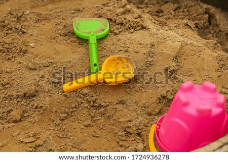 Colorful children`s sand toys outdoor.