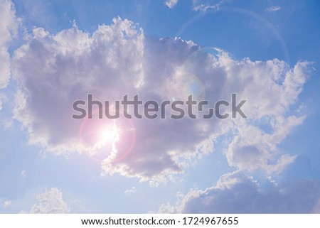 Natural light from the sun with blue sky and white clouds.