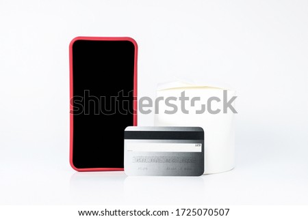 Wireless payment. Close up picture of a smartphone and a credit card