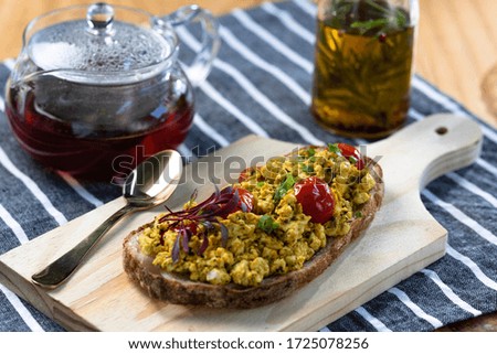 Breakfast table with natural fermentation toast and scrambled tofu. Vegan food.