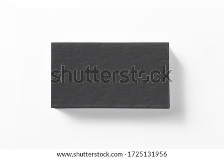 Blank black letterpress business cards stack isolated on white high view as template for design presentation, logo embossing, mock-up etc.