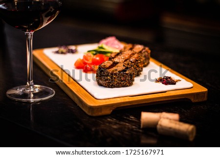filet minion grilled with tomatoes & wine
