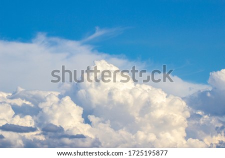 Lush cumulus clouds and blue sky background with copy space. Abstract style for texture, design, background,  website, pattern,  animation.