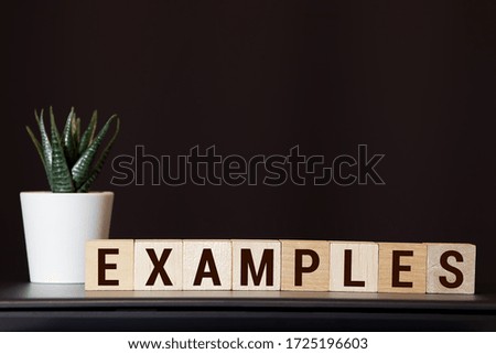 EXAMPLE word made with building blocks isolated on white