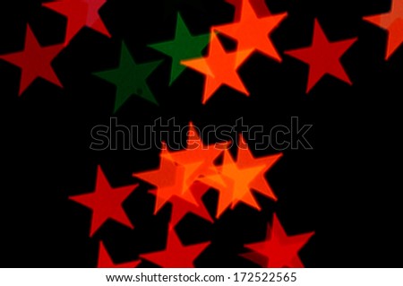 Colorful stars pattern abstract blur on black background.