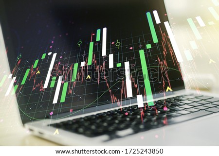 Double exposure of abstract creative financial diagram on modern laptop background, banking and accounting concept