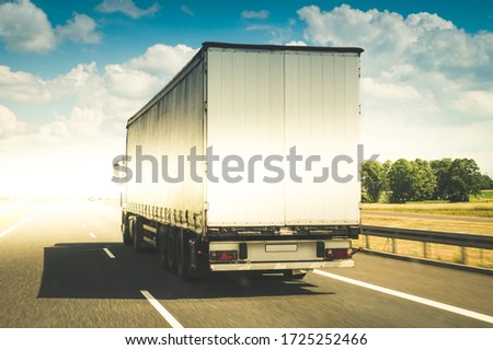 Truck/ 18-wheeler on a highway Royalty-Free Stock Photo #1725252466
