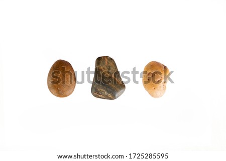 Three different stones on a white background