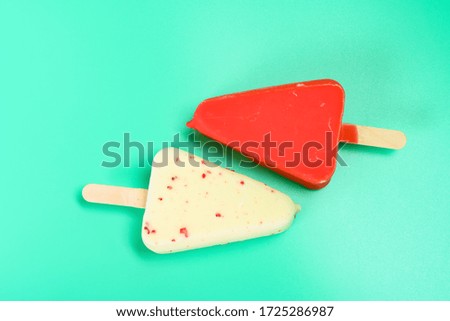 red and white chocolate outers popsicles on green background