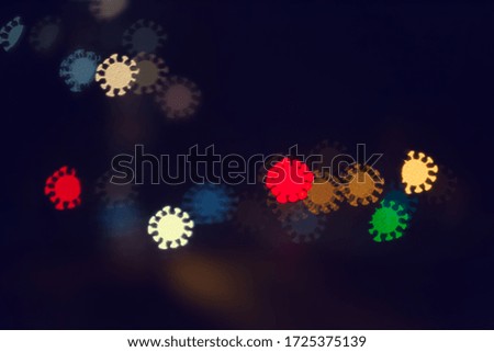 City lights and cars in the form of a bokeh in the form of a coronavirus, the concept of the spread of the covid 19 virus during the pandemic, abstract blurred background