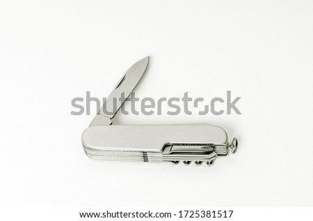 multifunctional knife on a white background close-up, layout, blank for your design, pocket small metal pocket knife on white