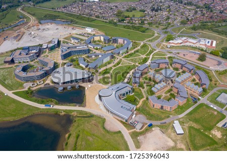 Aerial photo of the University of York, Campus East buildings in the City of York in North Yorkshire in the UK along side a lake on a sunny summers day taken with a drone