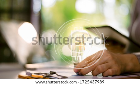 Light bulbs that grow in the concept  on desk,concept idea planning Business  - Image