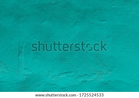 Turquoise plastered and textured wall background full of space for text Royalty-Free Stock Photo #1725524533